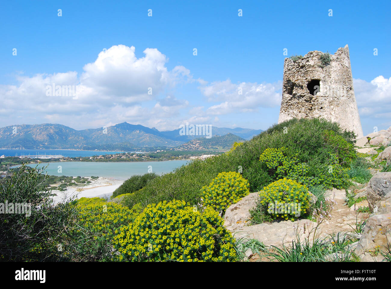 Background of spanish ancient toer of Porto Giunco in Villasimius (Sardinia) landscape Stock Photo