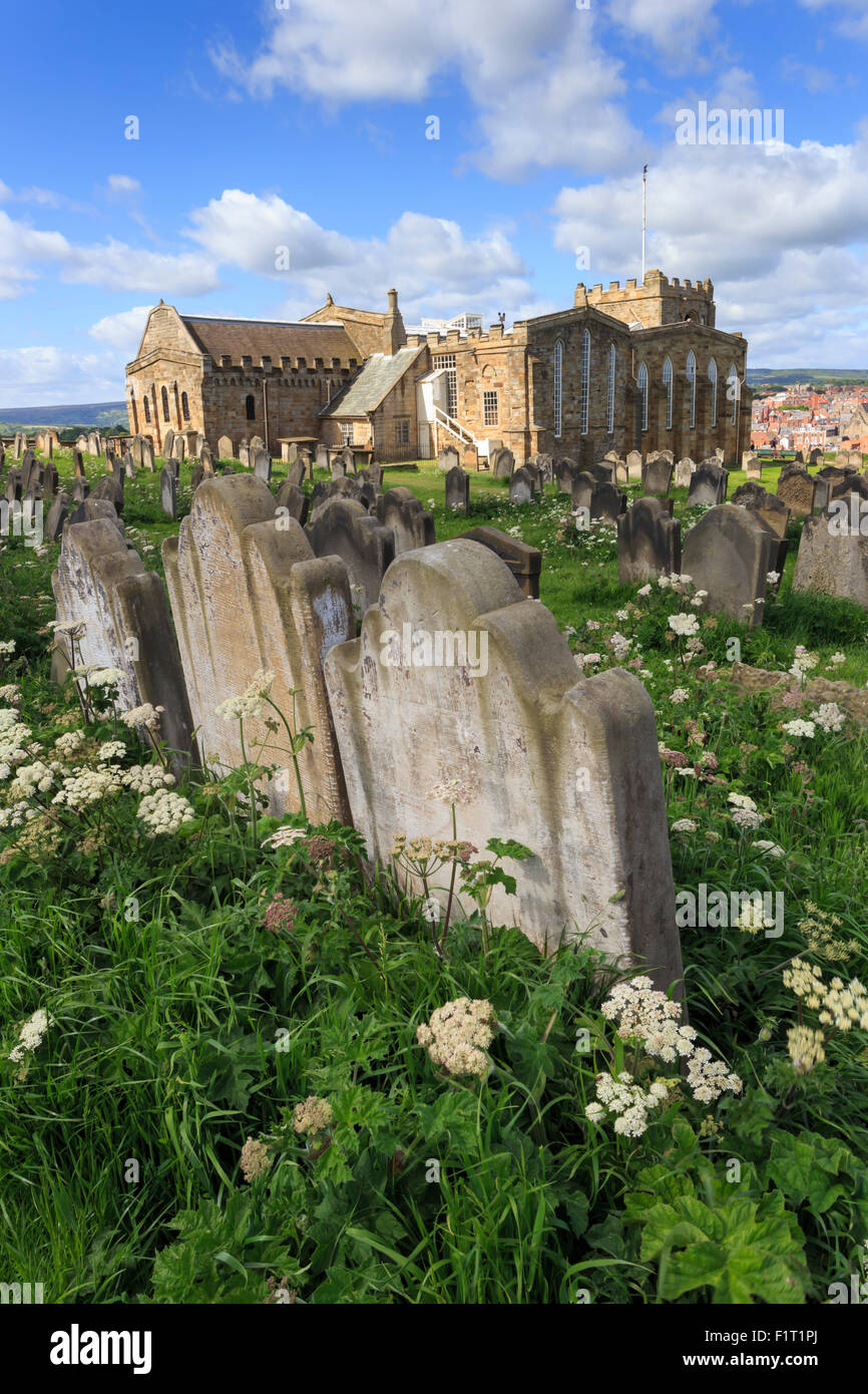 St. Mary's Church, gravestones in churchyard surrounded by cow parsely flowers in spring, Whitby, North Yorkshire, England, UK Stock Photo