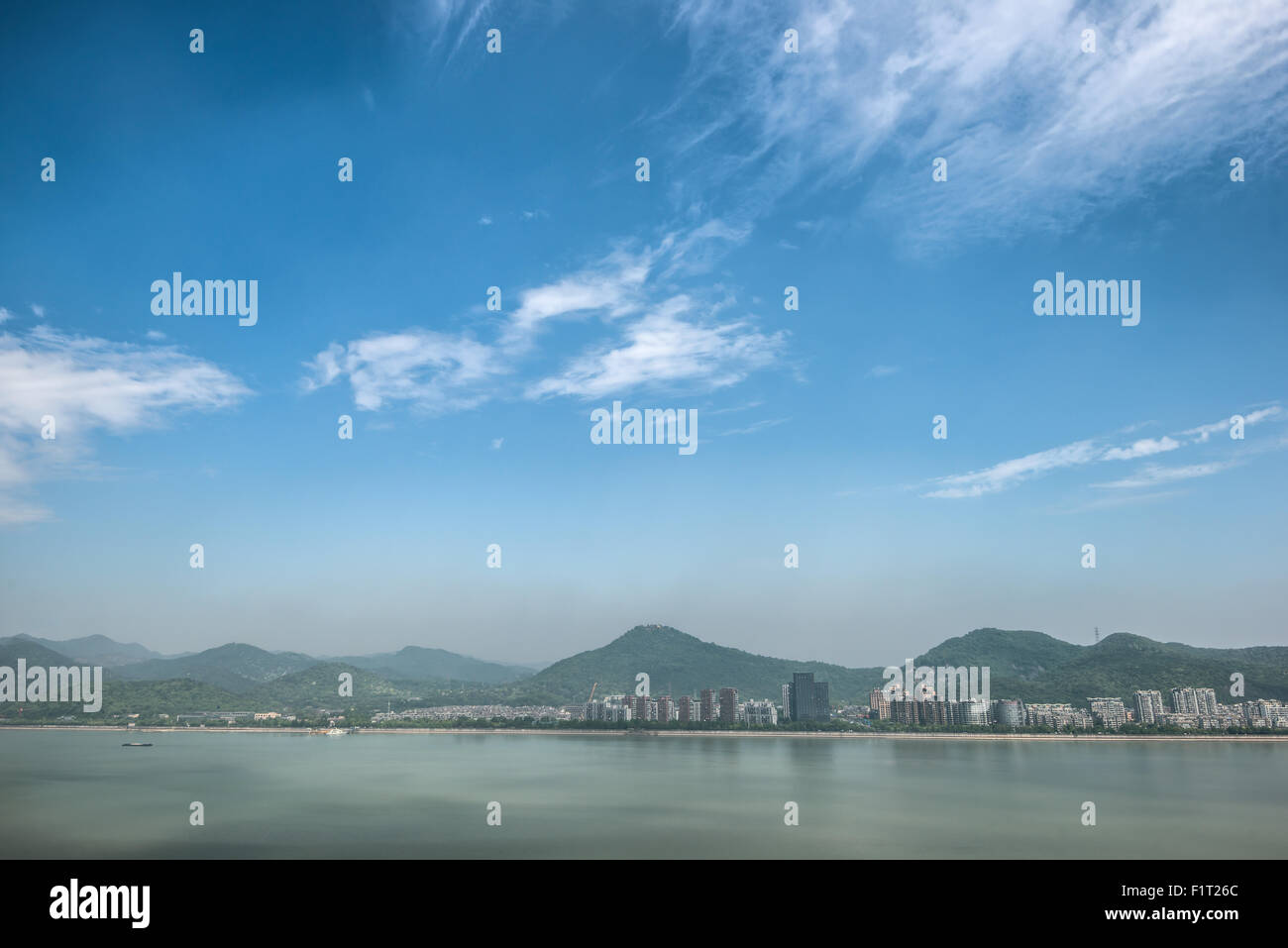 Qiantang River, hills and high rises of Hangzhou, Zhejiang, China, Asia Stock Photo
