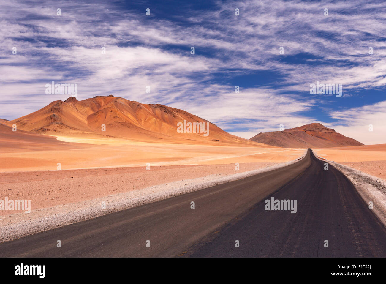 A high desert road through the Chilean Altiplano at an altitude of 4700m. Stock Photo