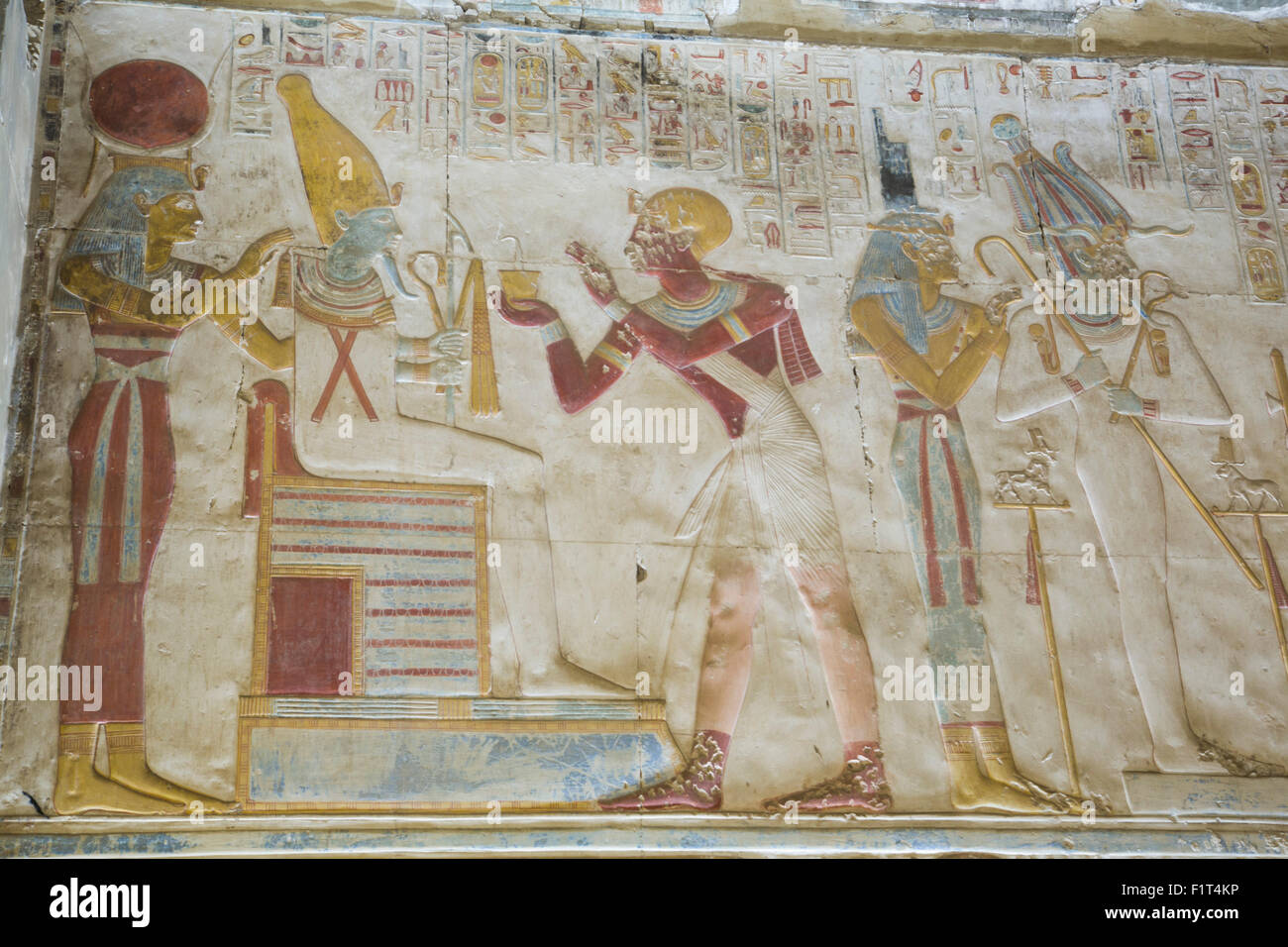 Pharaoh Seti I in center making an offering to the seated God Osiris, Temple of Seti I, Abydos, Egypt, North Africa, Africa Stock Photo