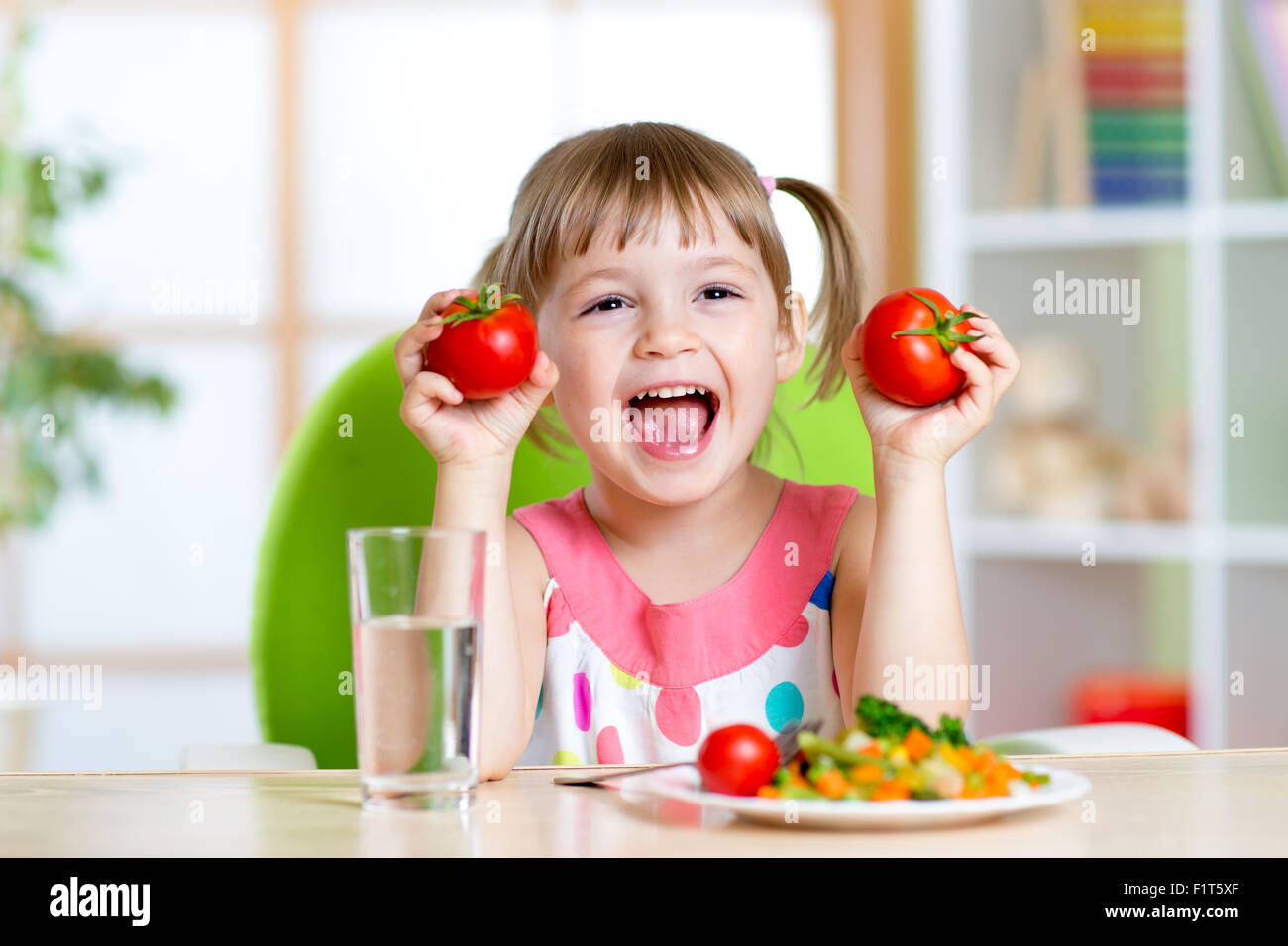 Portrait of happy child with vegetables Stock Photo