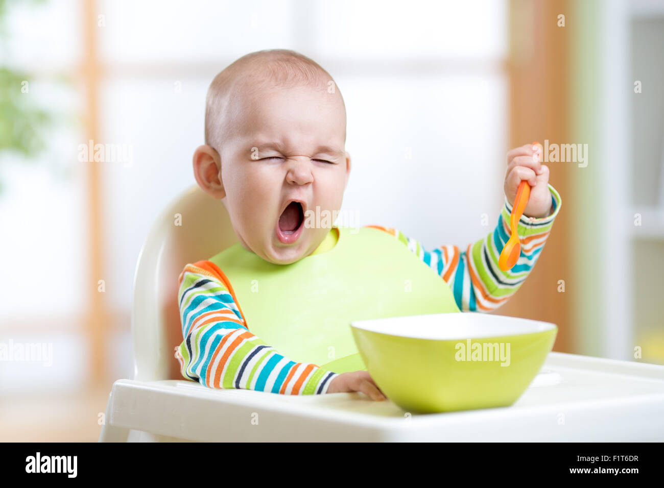 funny kid eating healthy food indoor Stock Photo