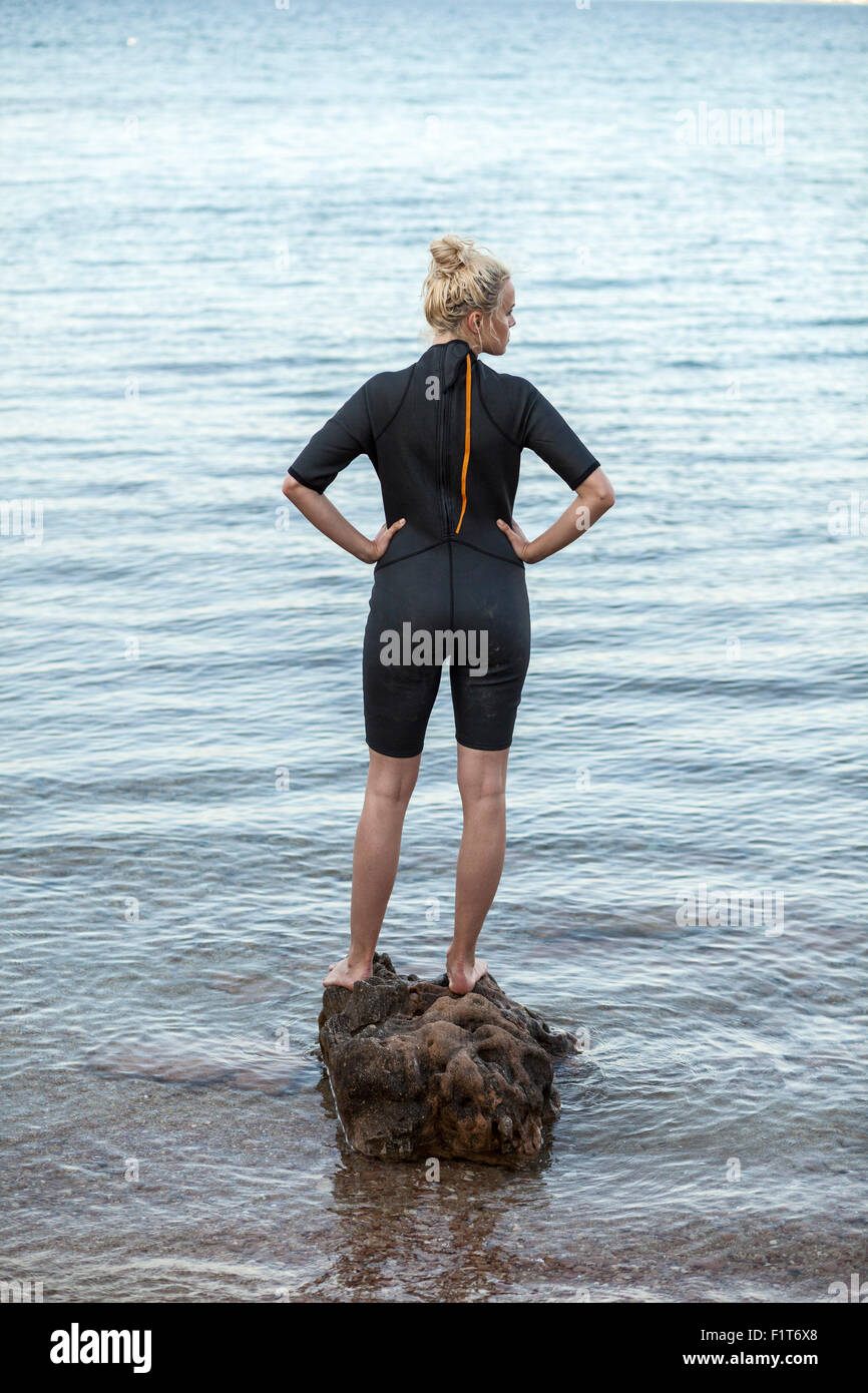 Young woman wearing wetsuit Stock Photo Alamy