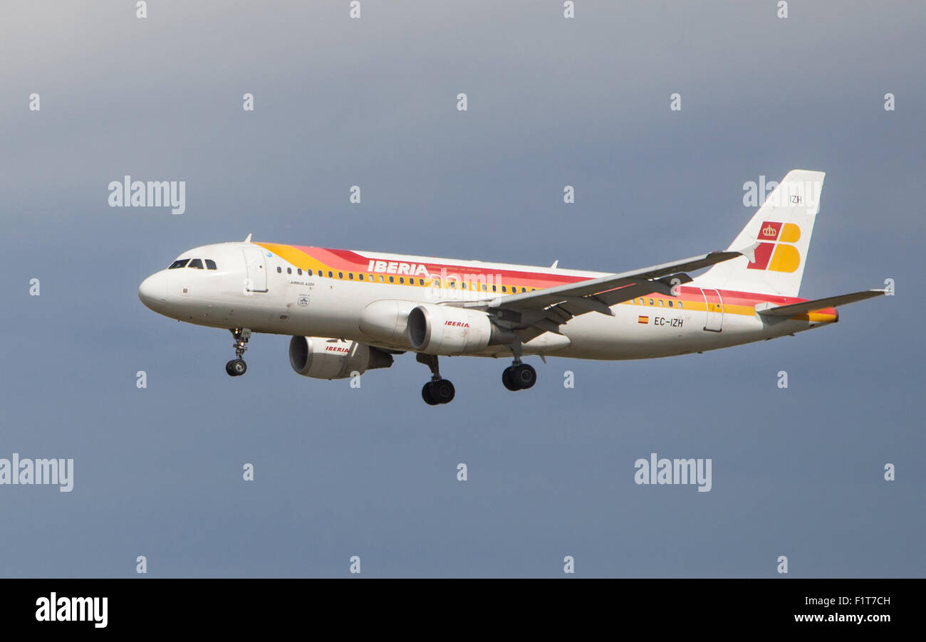 An Iberia Airbus A320 approaching to the El Prat Airport in Barcelona, Spain. Stock Photo