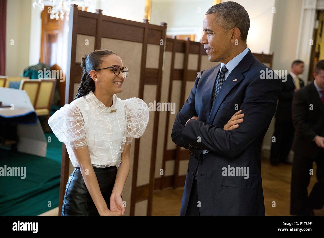 U.S. President Barack Obama talks with National Student Poet Madeline LaCesne in the Old Family Dining Room before she introduces him during the National Poetry Month Celebration event at the White House April 17, 2015 in Washington, DC. Stock Photo