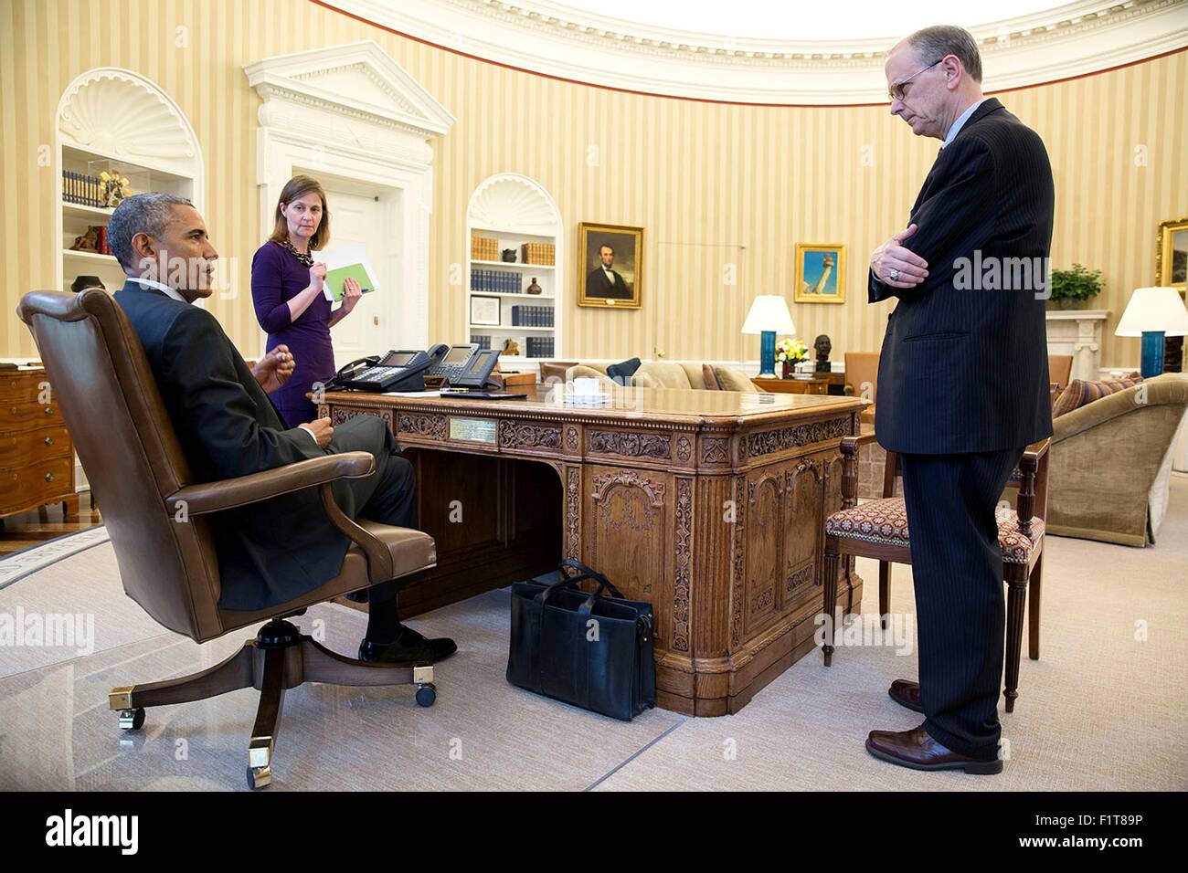 U.S. President Barack Obama meets with with Amy Rosenbaum, Deputy Assistant to the President for Legislative Affairs and Martin Paone, Deputy Assistant to the President for Legislative Affairs in the Oval Office of the White House April 20, 2015 in Washington, DC. Stock Photo