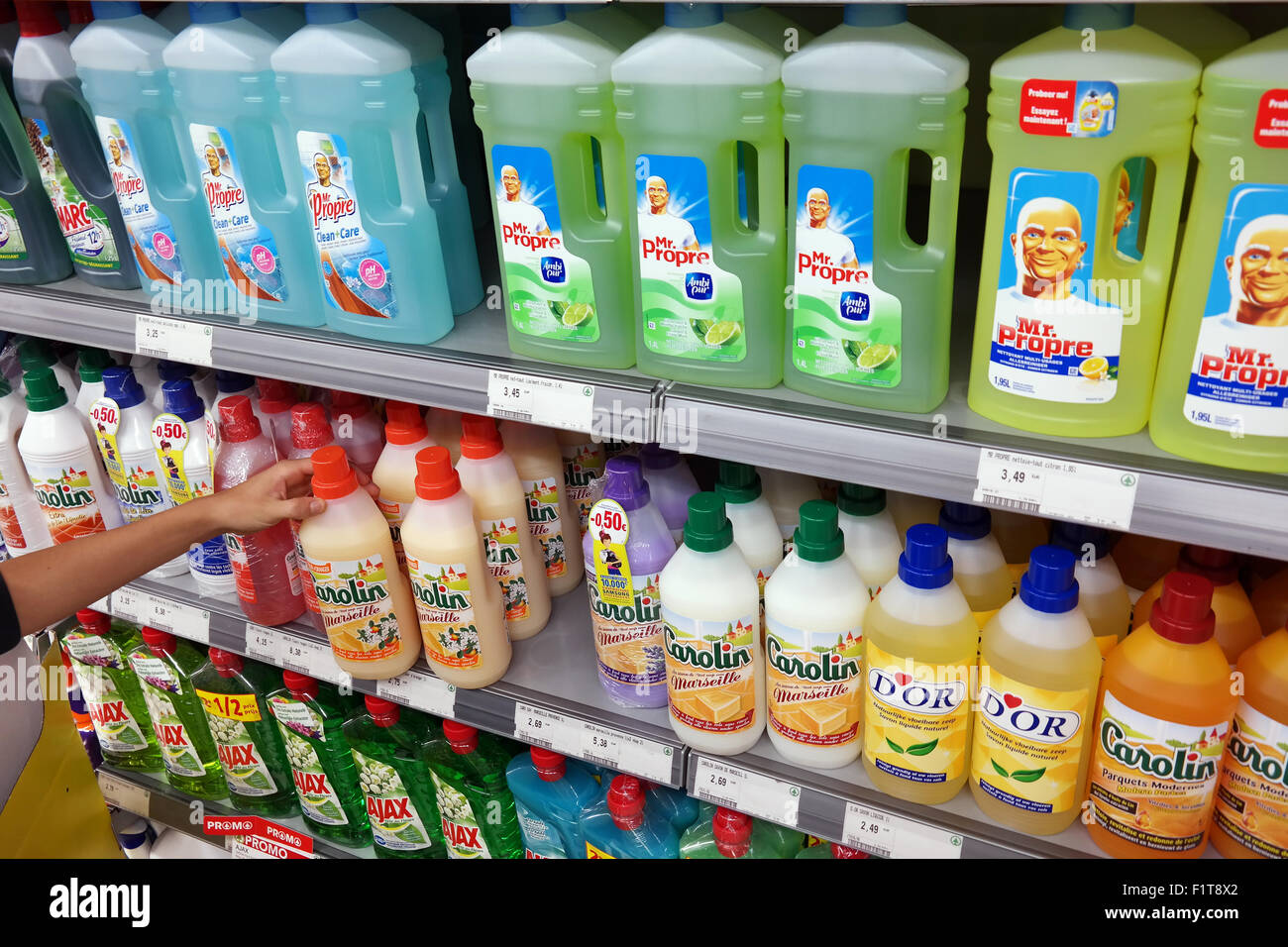 Shelves filled with variety of Bottles liquid All-purpose cleaner in a SPAR Supermarket in Belgium Stock Photo