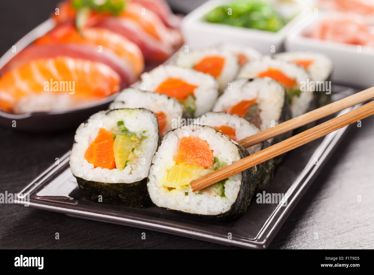 sushi pieces with chopsticks Stock Photo