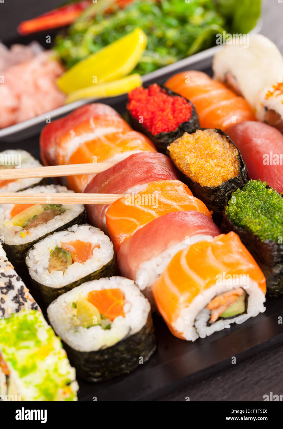 sushi pieces with chopsticks Stock Photo