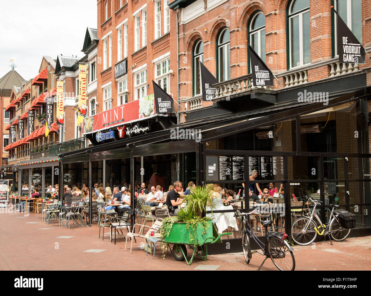 People sitting at street cafes, Eindhoven city centre, North Brabant province, Netherlands Stock Photo