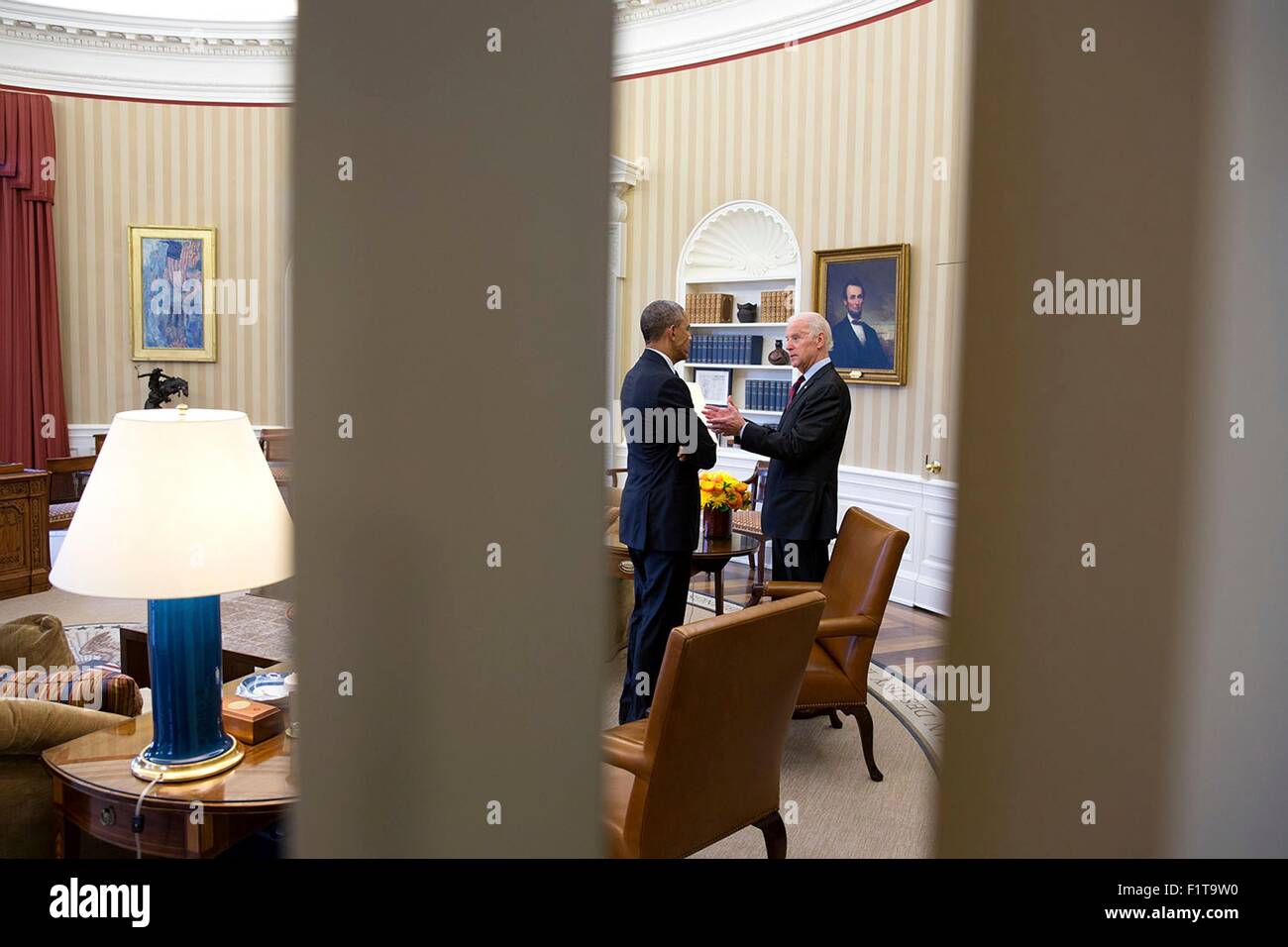 U.S. President Barack Obama talks with Vice President Joe Biden in the Oval Office of the White House April 15, 2015 in Washington, DC. Stock Photo