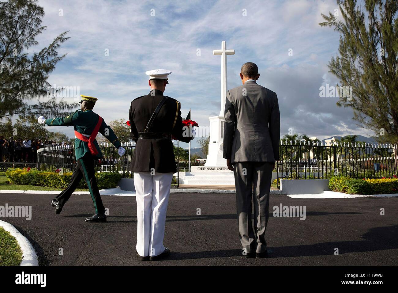 U.S. President Barack Obama and Marine Corps Military Aide Steven Schreiber participate in a wreath laying ceremony at National Heroes Park April 9, 2015 in Kingston, Jamaica. Stock Photo