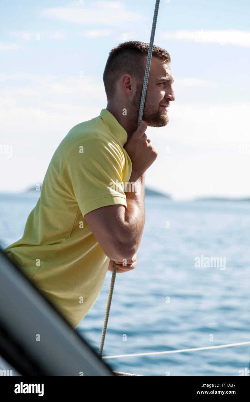 Man day dreaming on sailboat, Adriatic Sea Stock Photo