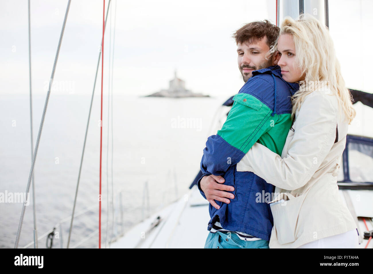 Young couple on sailboat, Adriatic Sea Stock Photo