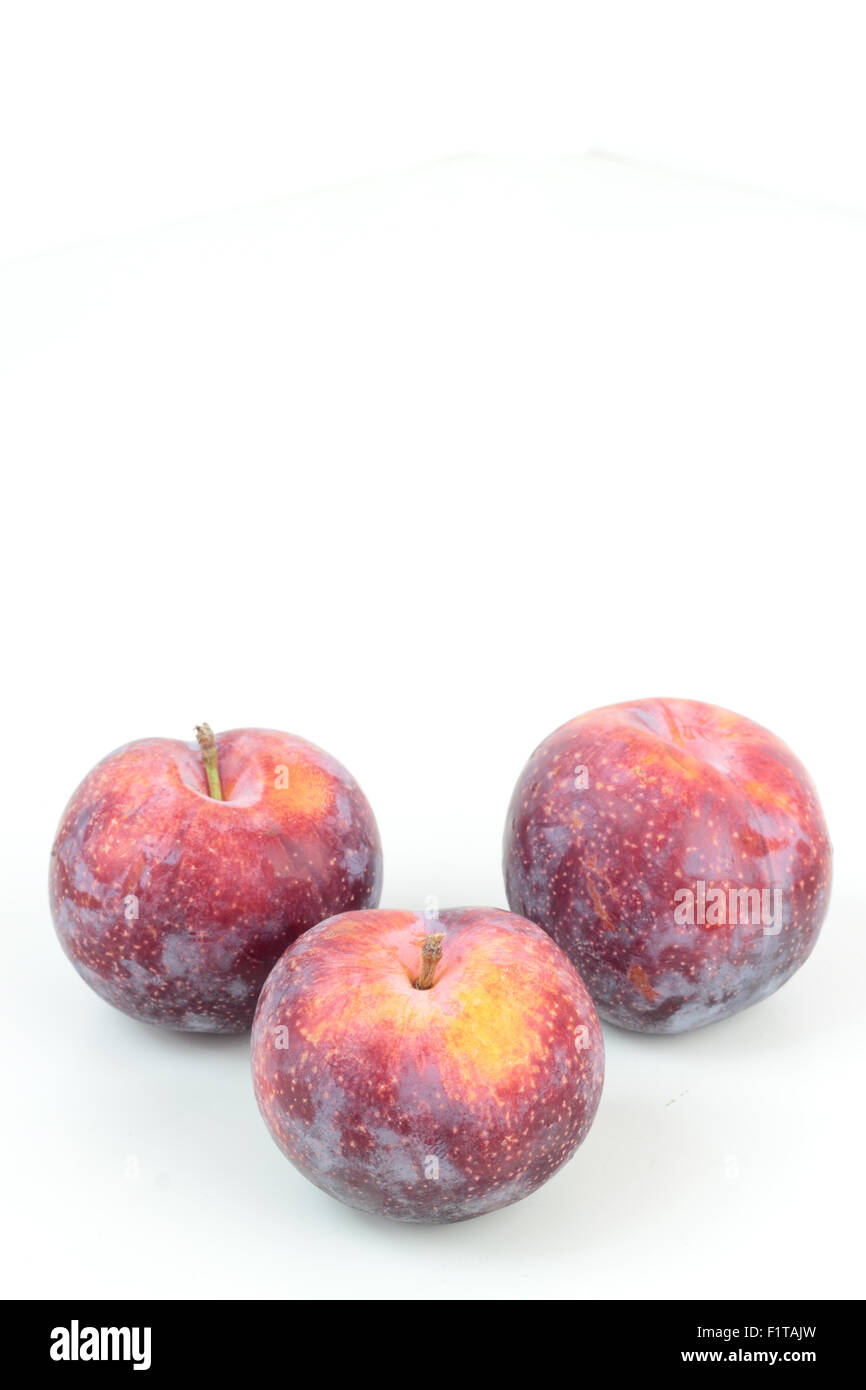 Closeup of ripe plums isolated on white Stock Photo - Alamy