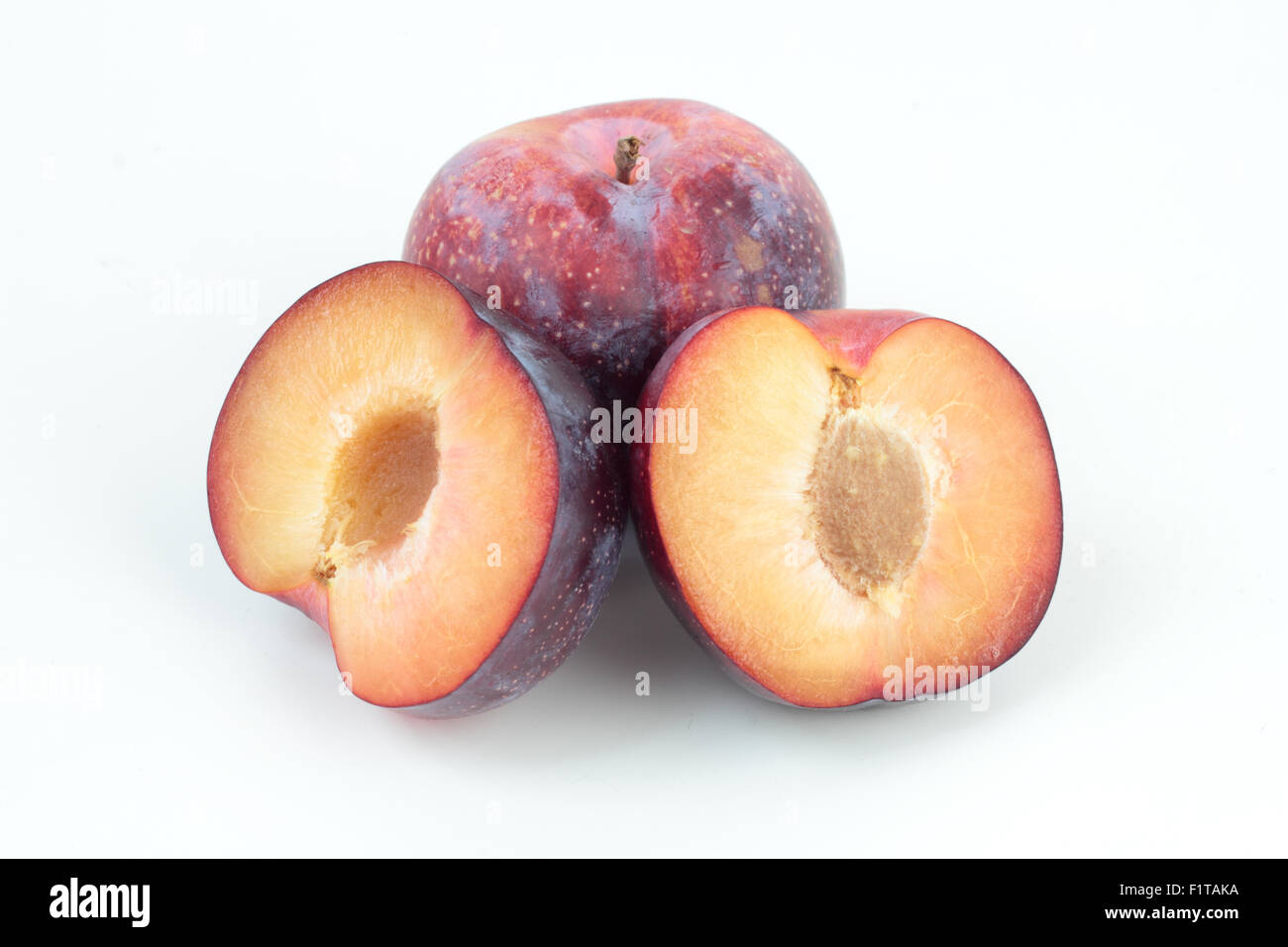 Closeup of ripe plums isolated on white Stock Photo - Alamy