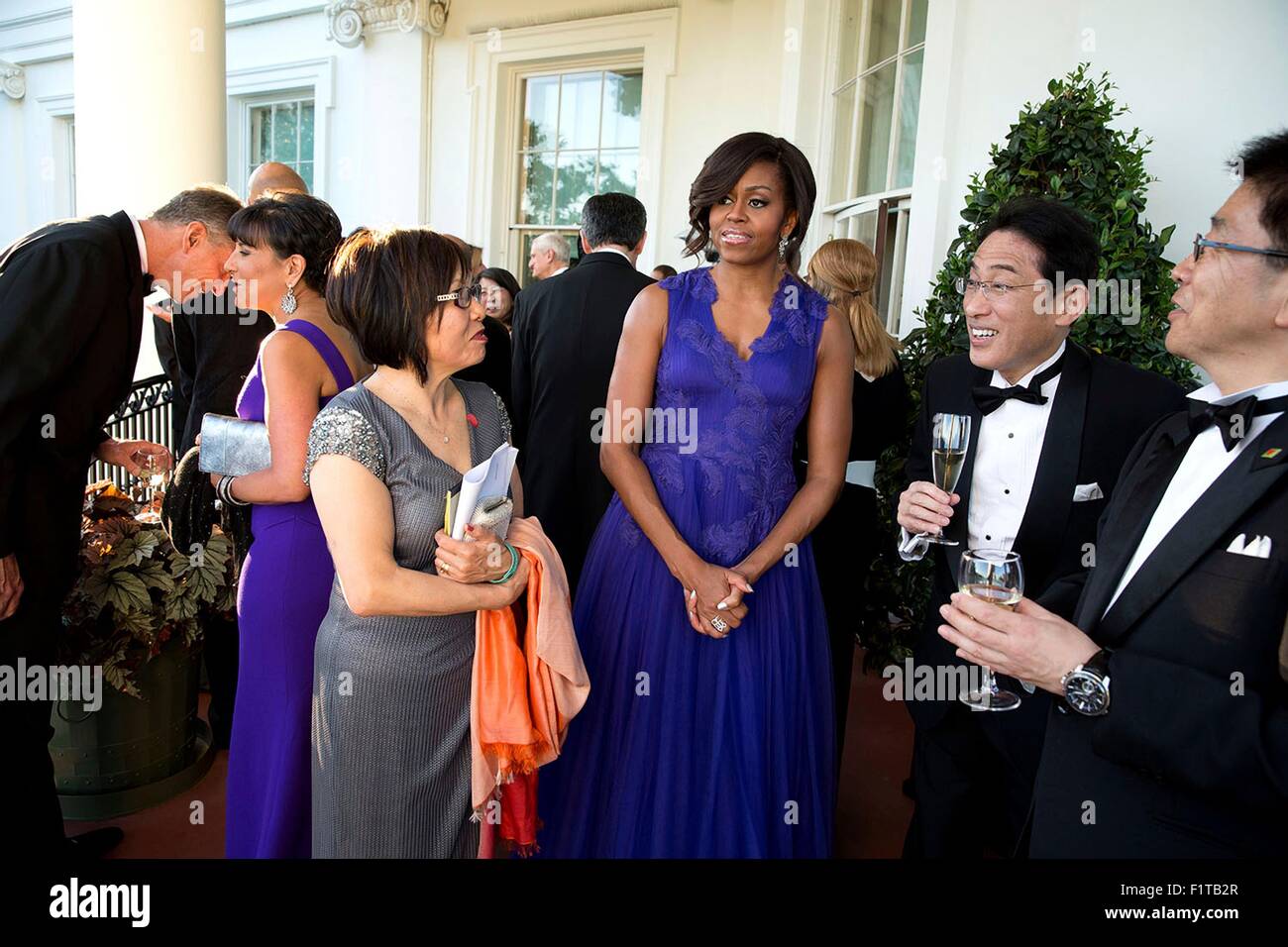 U.S. President Barack Obama and First Lady Michelle Obama host a reception for Prime Minister Shinzo Abe of Japan and First Lady Akie Abe on the Truman Balcony of the White House prior to the State Dinner April 28, 2015 in Washington, DC. Stock Photo