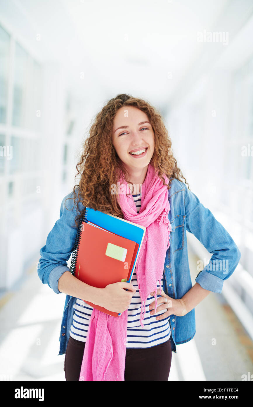 Pretty college learner looking at camera with smile Stock Photo - Alamy
