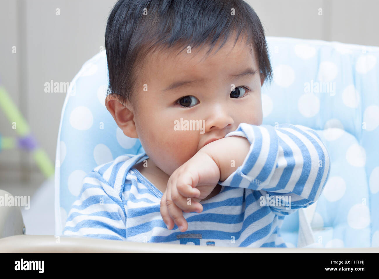 Indian boy sitting chair hi-res stock photography and images - Alamy