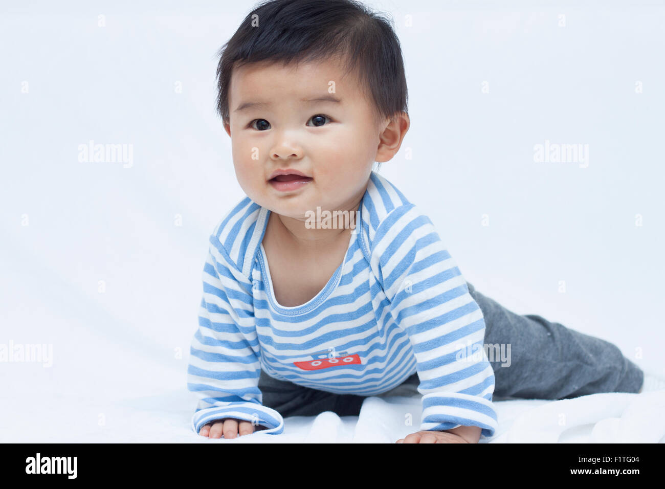 Cute Chinese baby boy in sailor suit Stock Photo