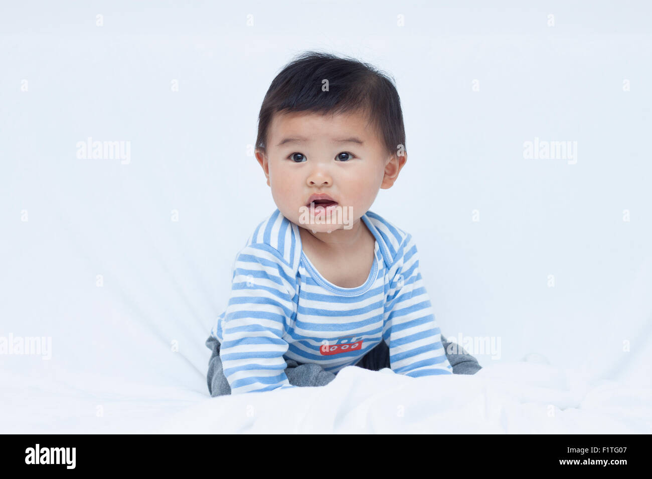 Cute Chinese baby boy in sailor suit Stock Photo