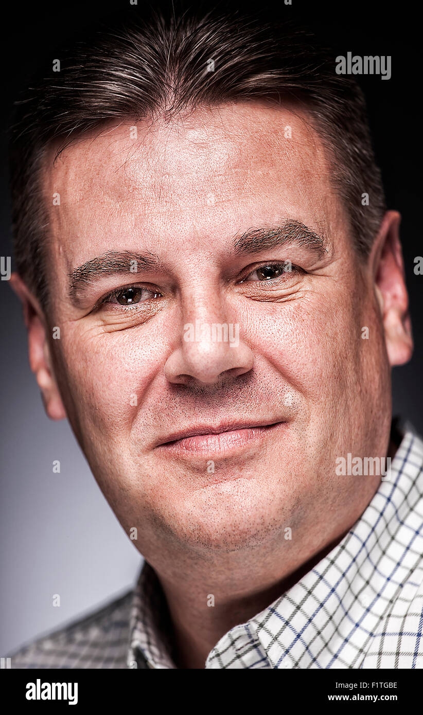 A black and white portrait of a white male in his 40's. Stock Photo