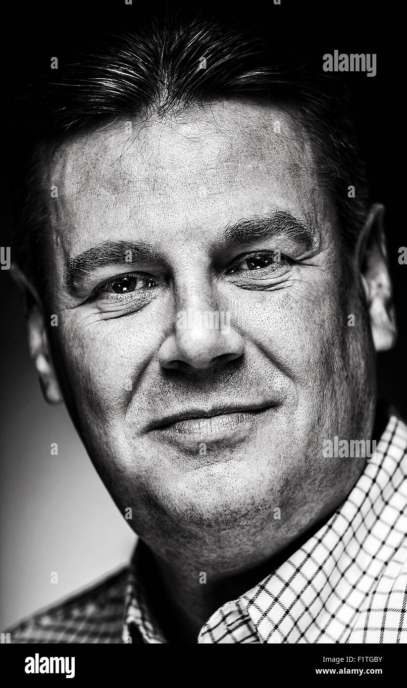 A black and white portrait of a white male in his 40's. Stock Photo