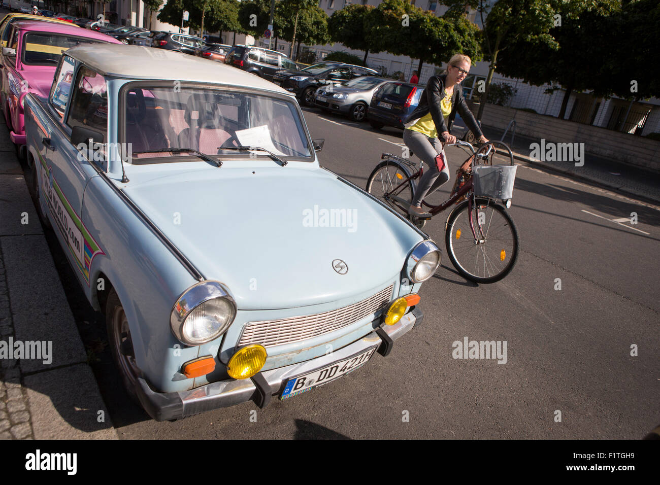 Berlin , Germany. Trabant car and cyclist Stock Photo