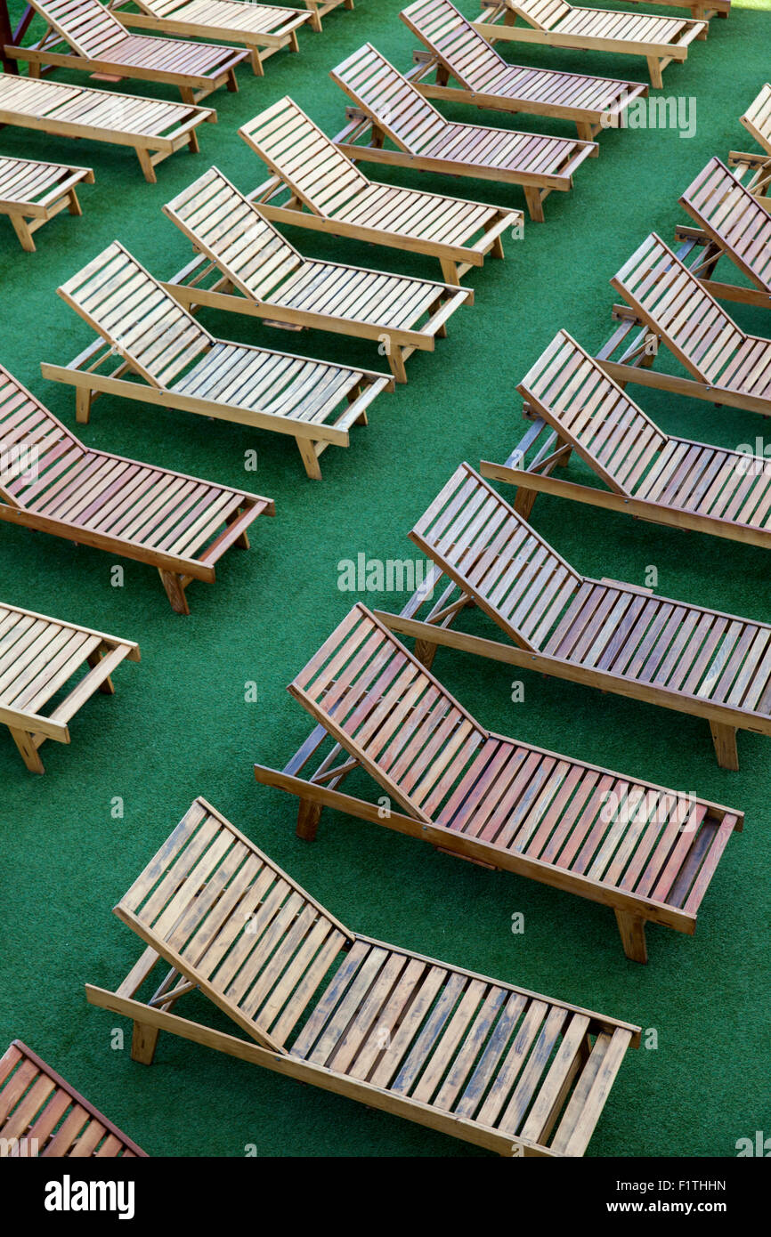 Wooden chairs on pool outside Stock Photo