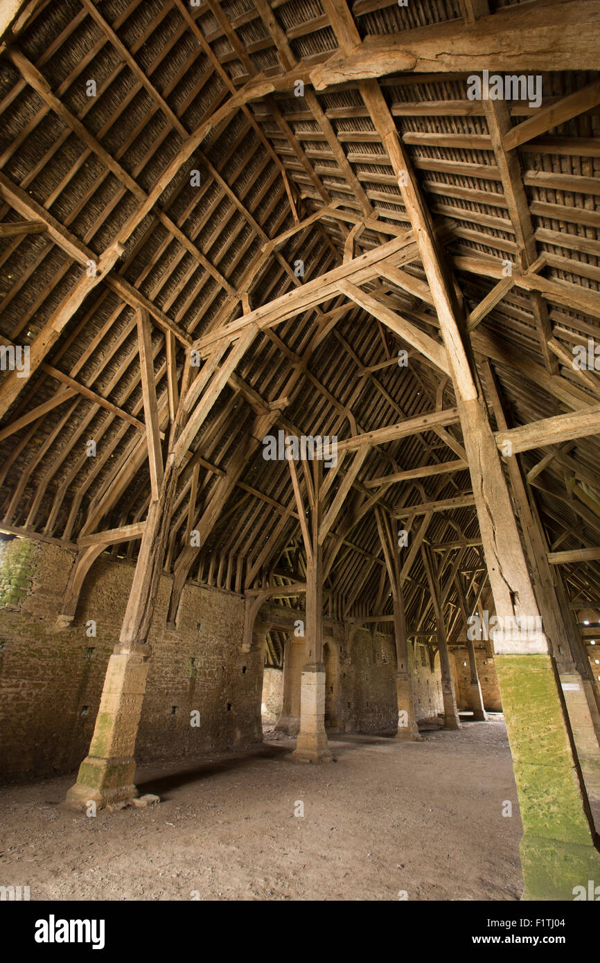 UK, Oxfordshire, Faringdon, Great Coxwell, 14th century Tithe Barn interior roof supported on stone aisle posts Stock Photo
