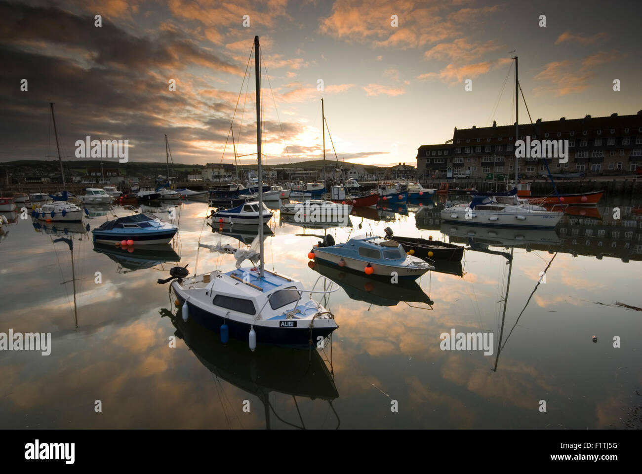 Dawn at West Bay Harbour near Bridport on Dorset's Jurassic Coast, England, UK Stock Photo