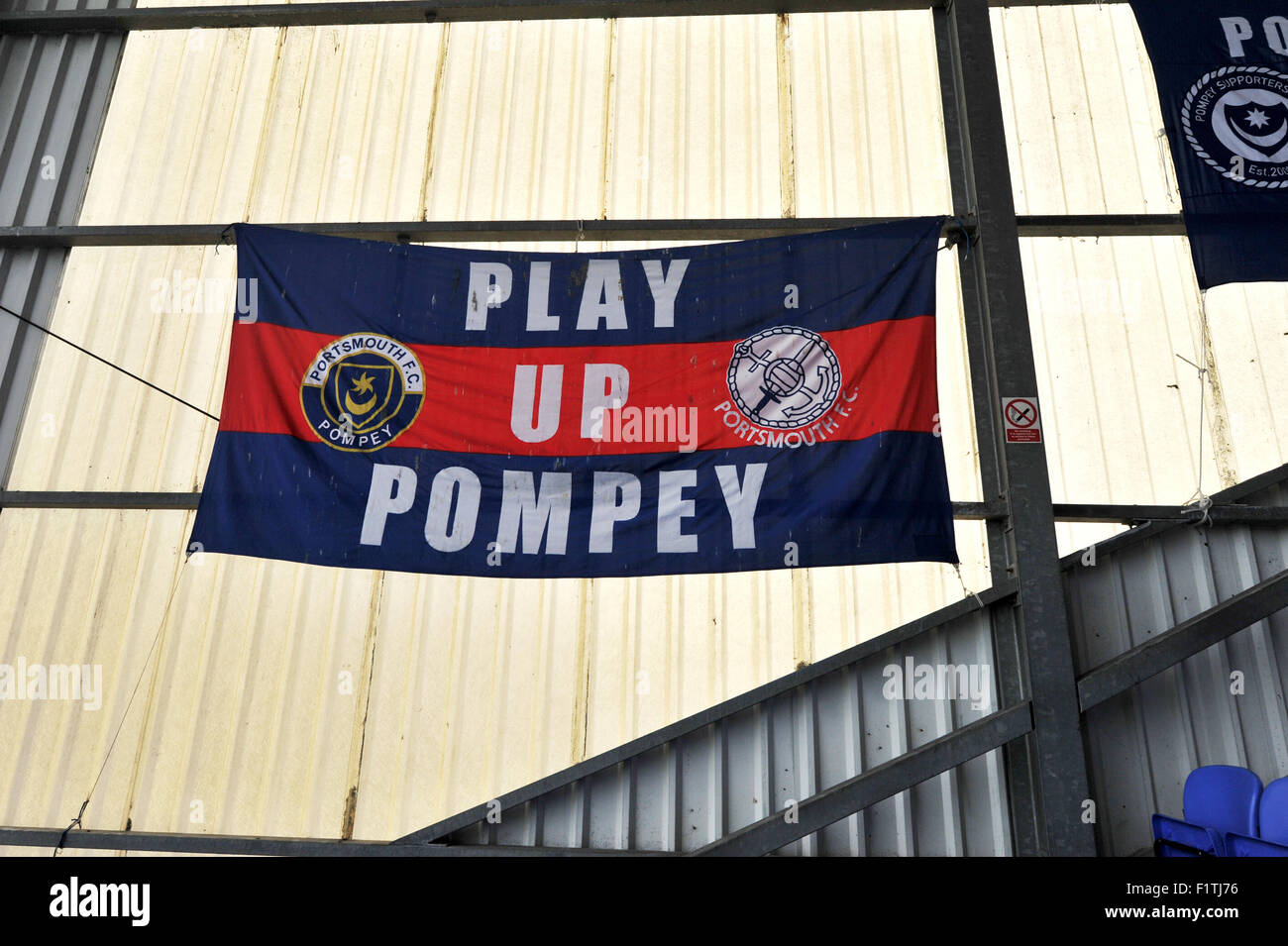 Portsmouth Hampshire UK - Fratton Park Football Ground with Play Up Pompey flag banner - Editorial use only. No merchandising. For Football images FA and Premier League restrictions apply inc. no internet/mobile usage without FAPL license - for details contact Football Dataco Stock Photo
