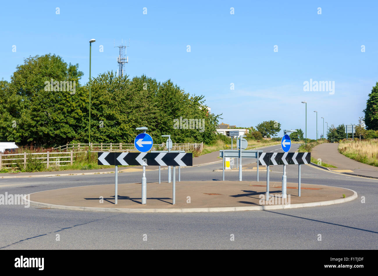Roundabout junction with no cars on a road in England, UK. Stock Photo