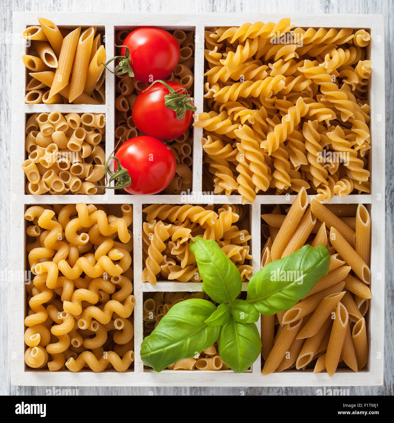 various raw wholegrain pasta in white wooden box Stock Photo - Alamy