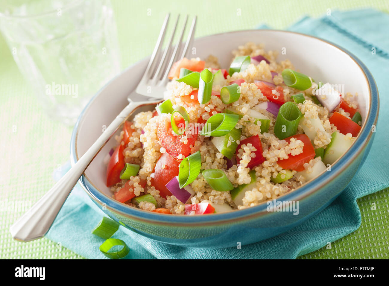 healthy quinoa salad with tomato cucumber onion chives Stock Photo Alamy