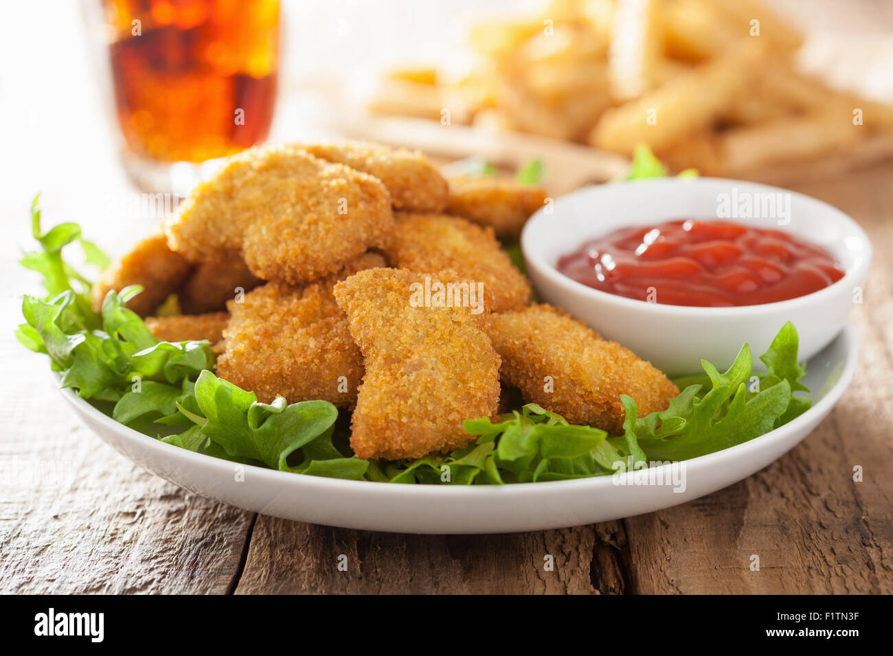 fast food chicken nuggets with ketchup, french fries, cola Stock Photo
