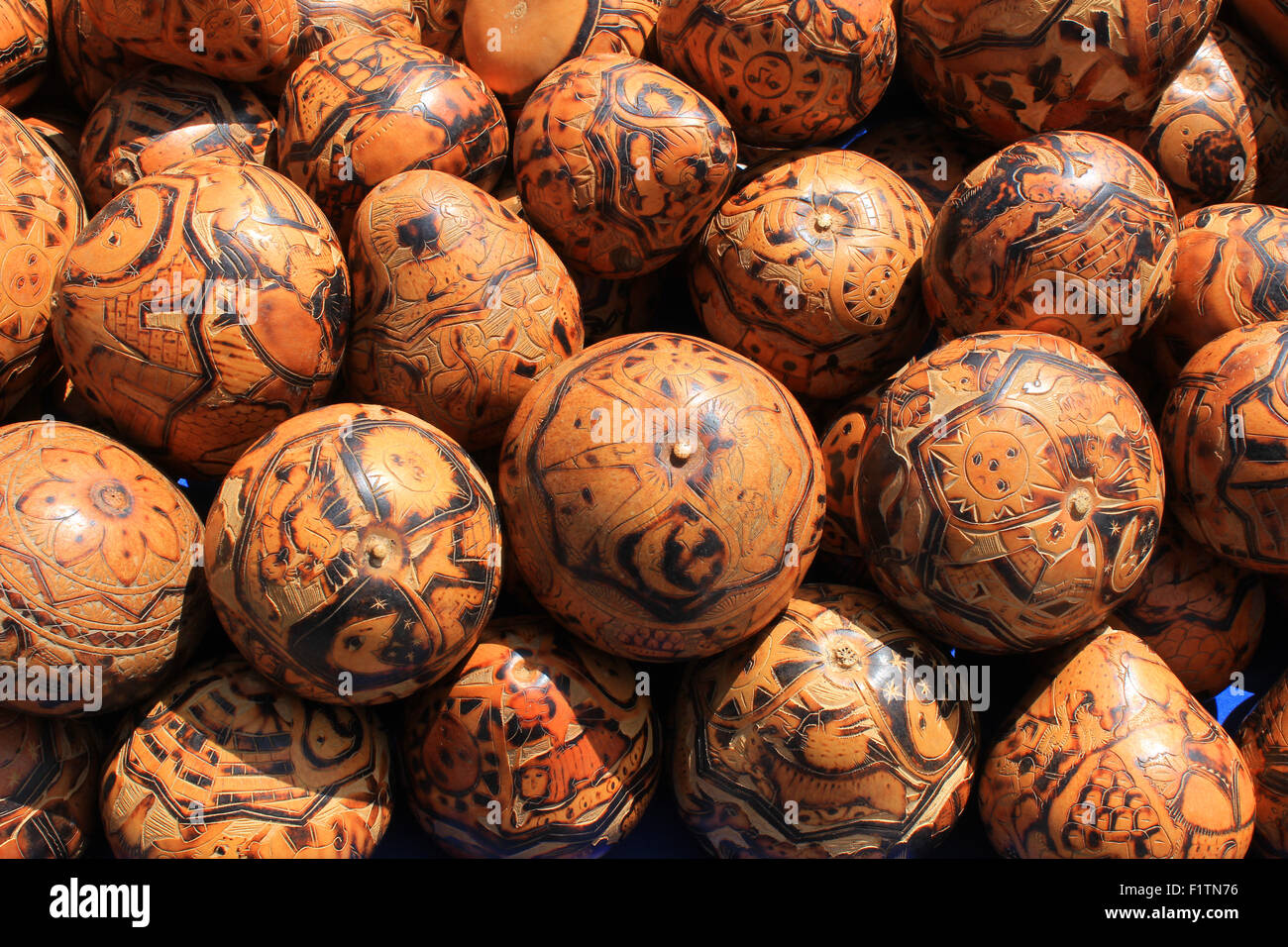 Colorful painted gourds at the outdoor craft market in Otavalo, Ecuador Stock Photo