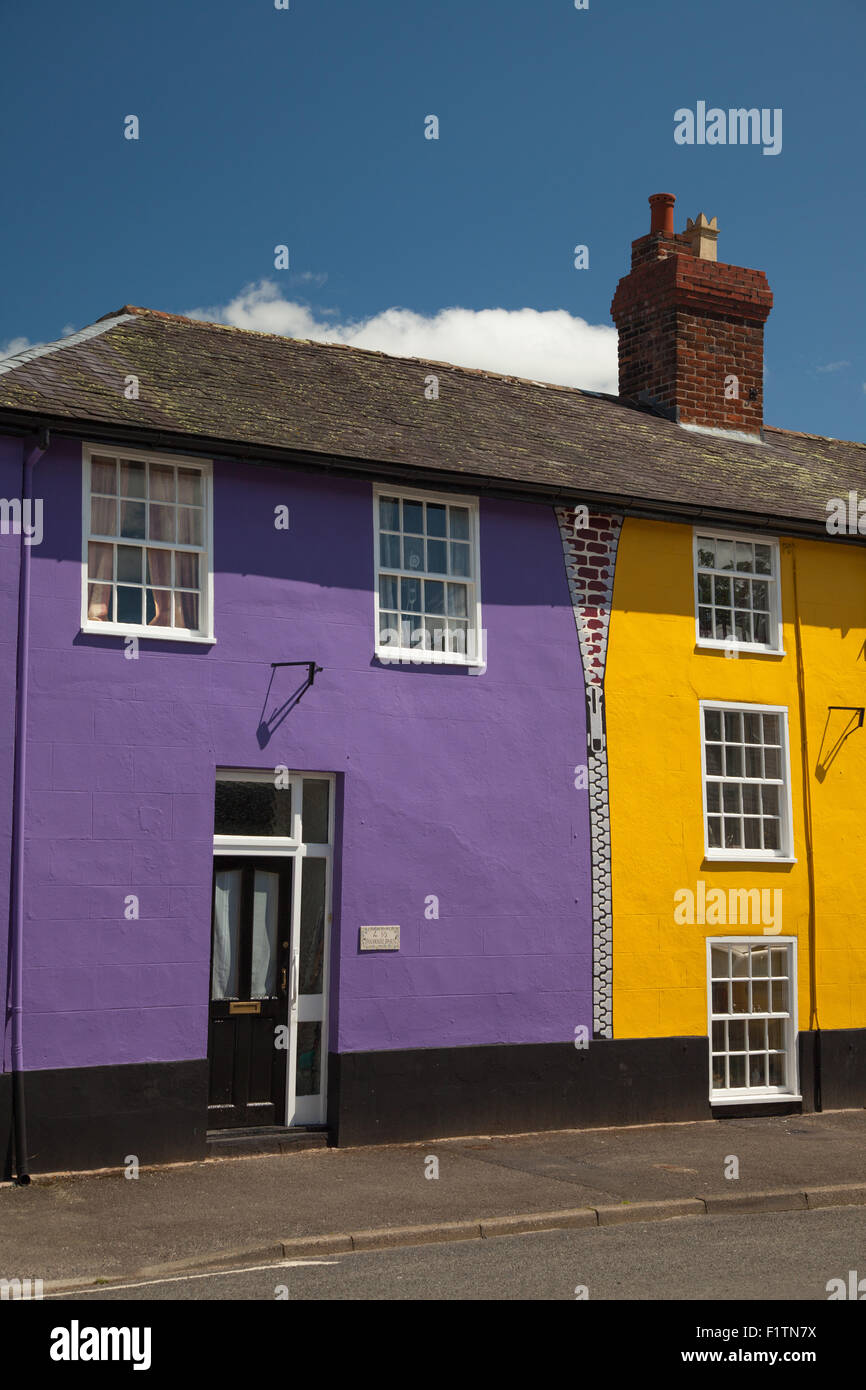 A row of houses in Bishop's Castle Shropshire painted bright funky colours. Stock Photo