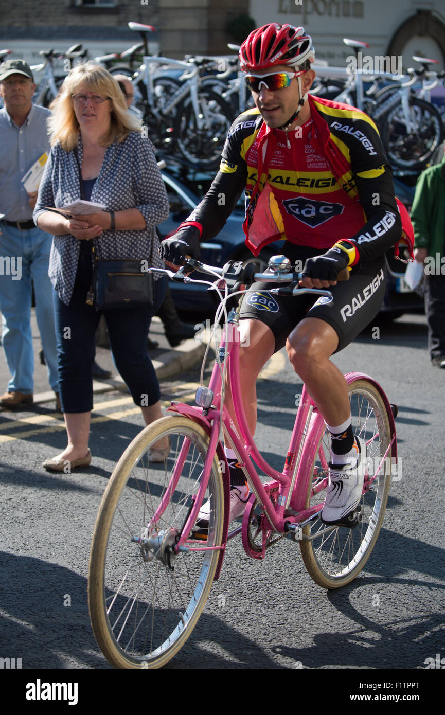 Stage 2 Aviva Tour of Britain cycle race at stage 2 start in Clitheroe, Lancashire. A Team Raleigh rider warms up on something a little different. Stock Photo