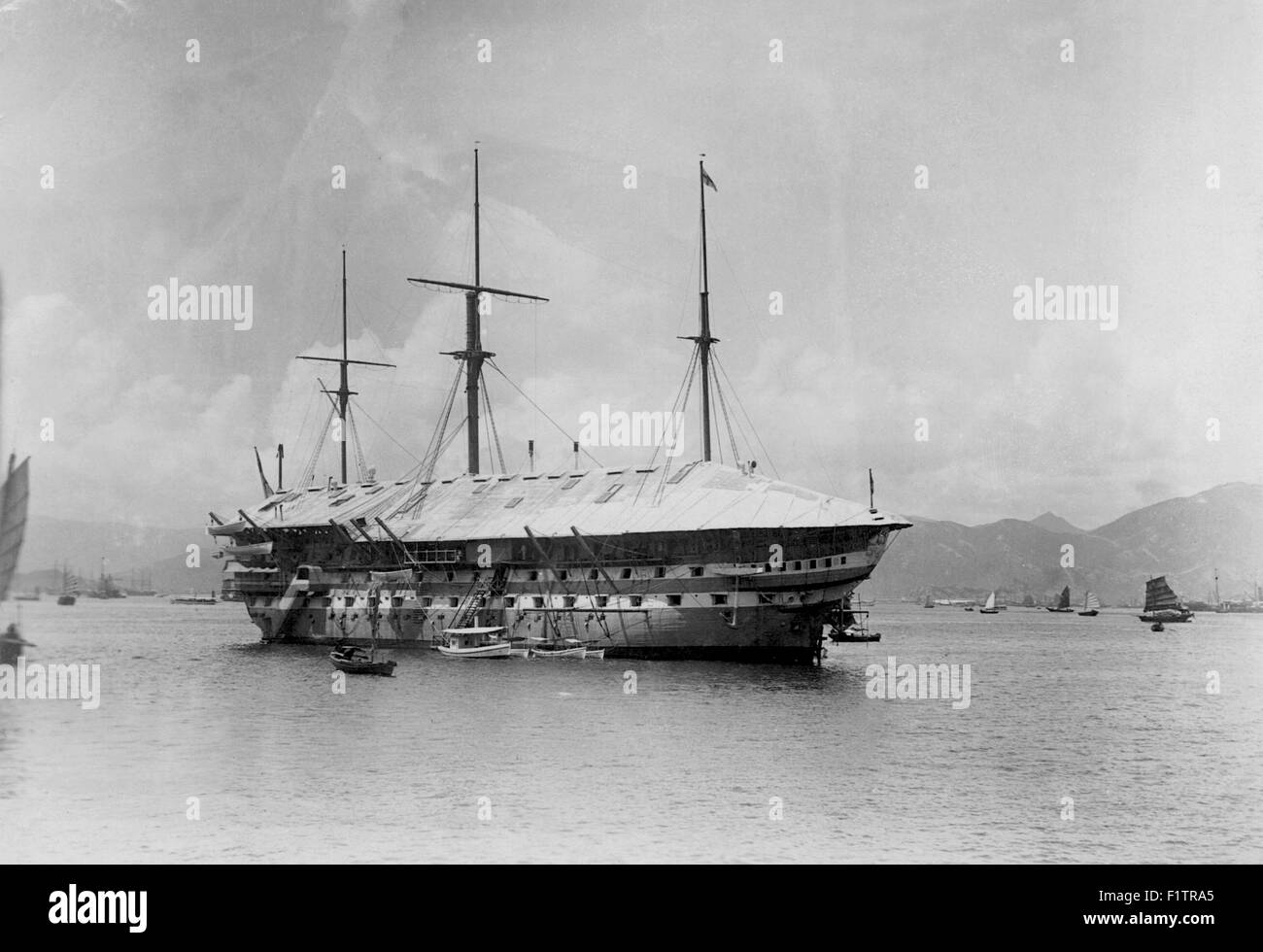 AJAXNETPHOTO. (AJAX VINTAGE COLLECTION) 1873-1887 APPROX. - HONG KONG HARBOUR - WARSHIP - TWO DECK AGAMEMNON CLASS SCREW POWERED 91 GUN HOSPITAL AND RECEIVING SHIP H.M.S. VICTOR EMMANUEL MOORED IN MAN-OF-WAR ANCHORAGE HONG KONG HARBOUR IN LATE 19TH CENTURY. BUILT AND NAMED ORIGINALLY AS SECOND RATE HMS REPULSE AT PEMBROKE DOCKYARD AND LAUNCHED IN 1855. SOLD IN 1899. PHOTO:AJAX VINTAGE PICTURE LIBRARY REF:AVL 1873 1 Stock Photo