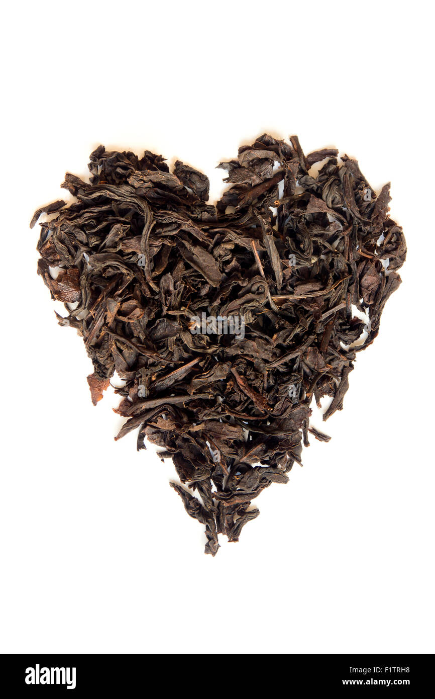 Dry black tea heart shape isolated on white background Stock Photo Alamy