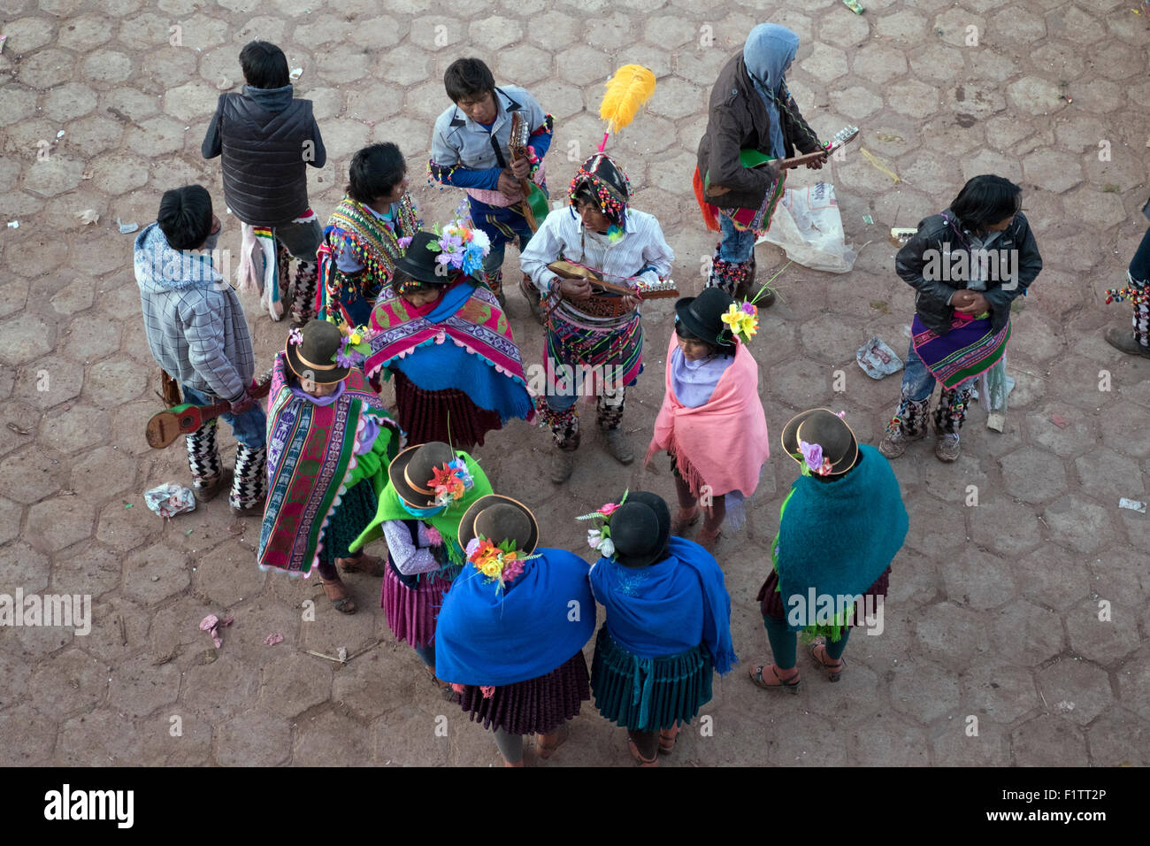 A group of participants at the celebration of the Tinku sing and play their instruments in the town square. Stock Photo