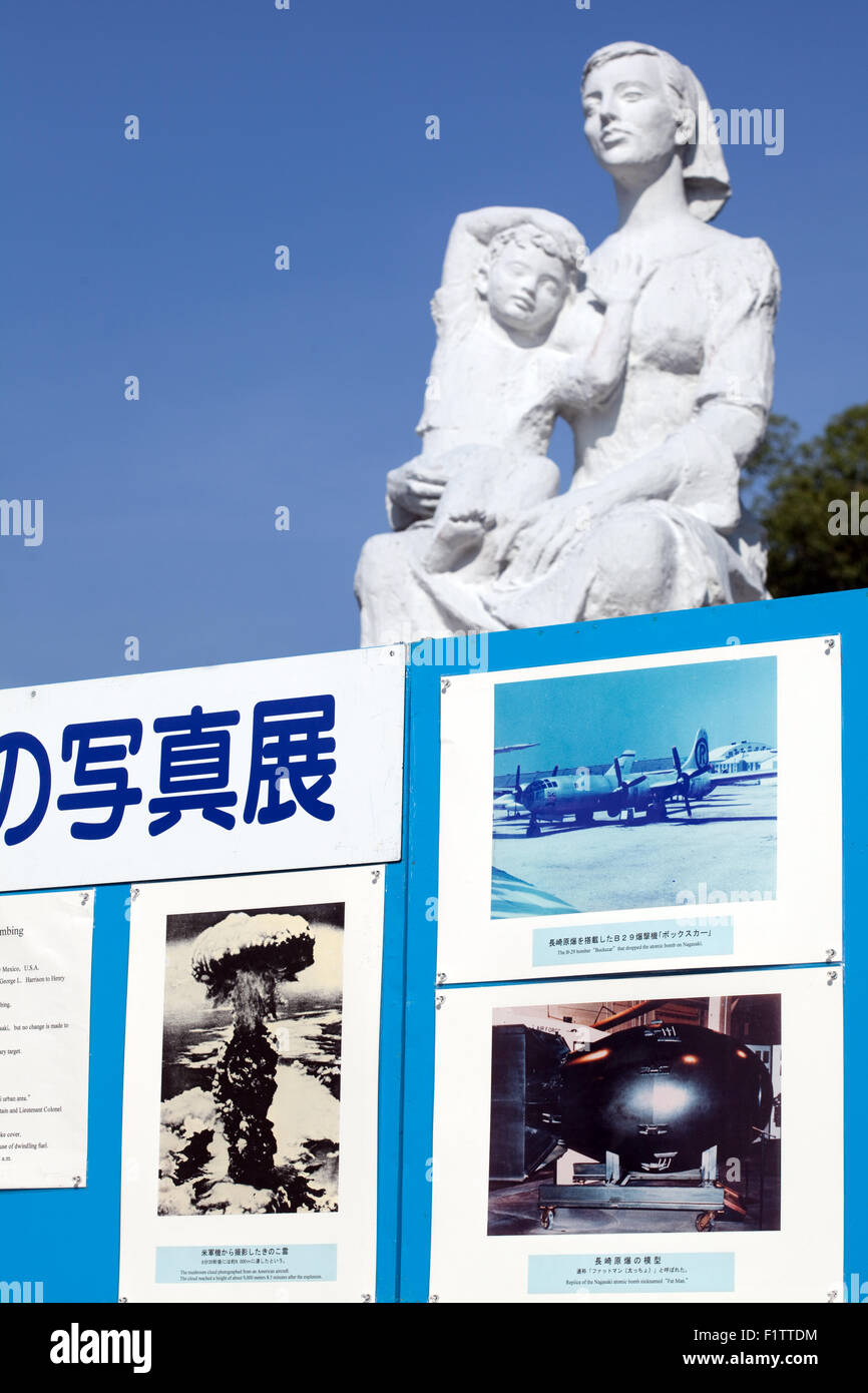 Statue of Peace Nagasaki Peace Park,Japan donated by the Union of Soviet Socialist Republics, behind display images of atom bomb Stock Photo