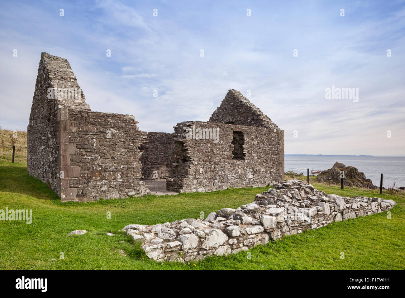St Ninian's Chapel at the Isle of Whithorn, Wigtownshire, Scotland, and part of its surrounding wall. The chapel dates from... Stock Photo