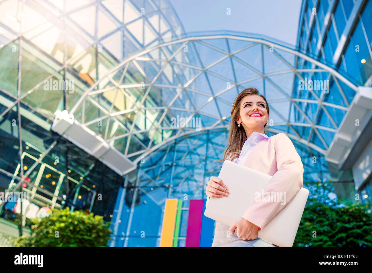 Smiling business woman sky hi-res stock photography and images - Alamy