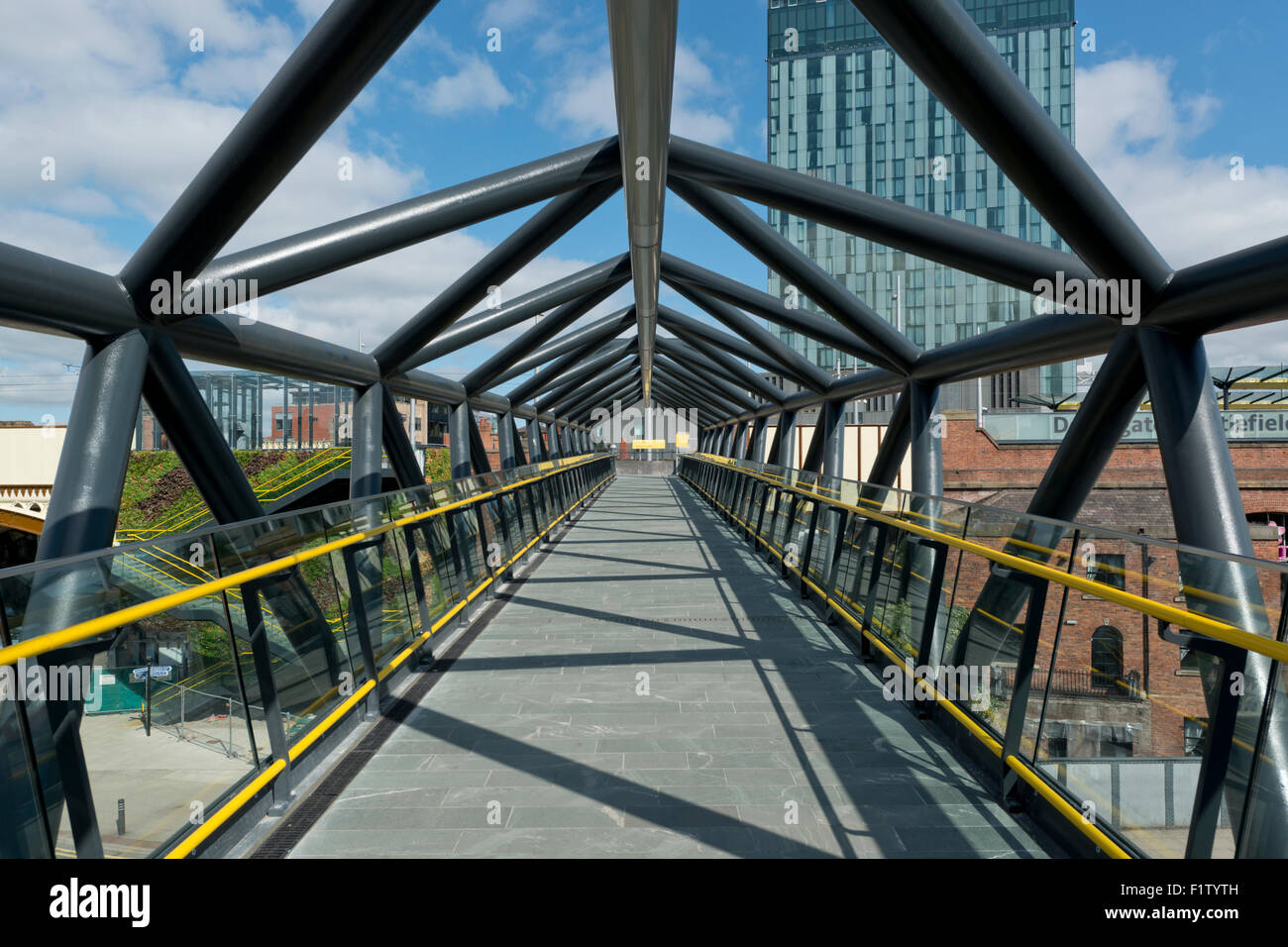 The refurbished Exhibition Footbridge crossing Whitworth Street West near Deansgate in Manchester. Stock Photo