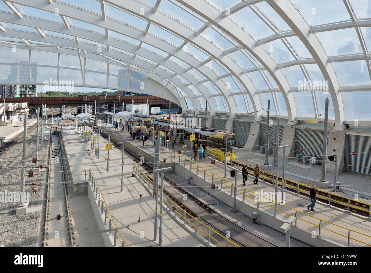 The inside area of the refurbished Victoria Station in Manchester, featuring a Metrolink LRT tram Stock Photo