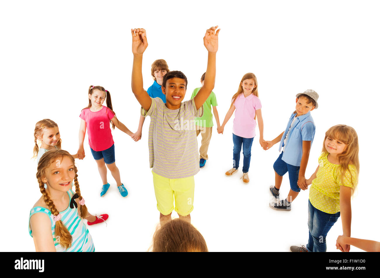 Nice looking boy stand in circle of other kids Stock Photo