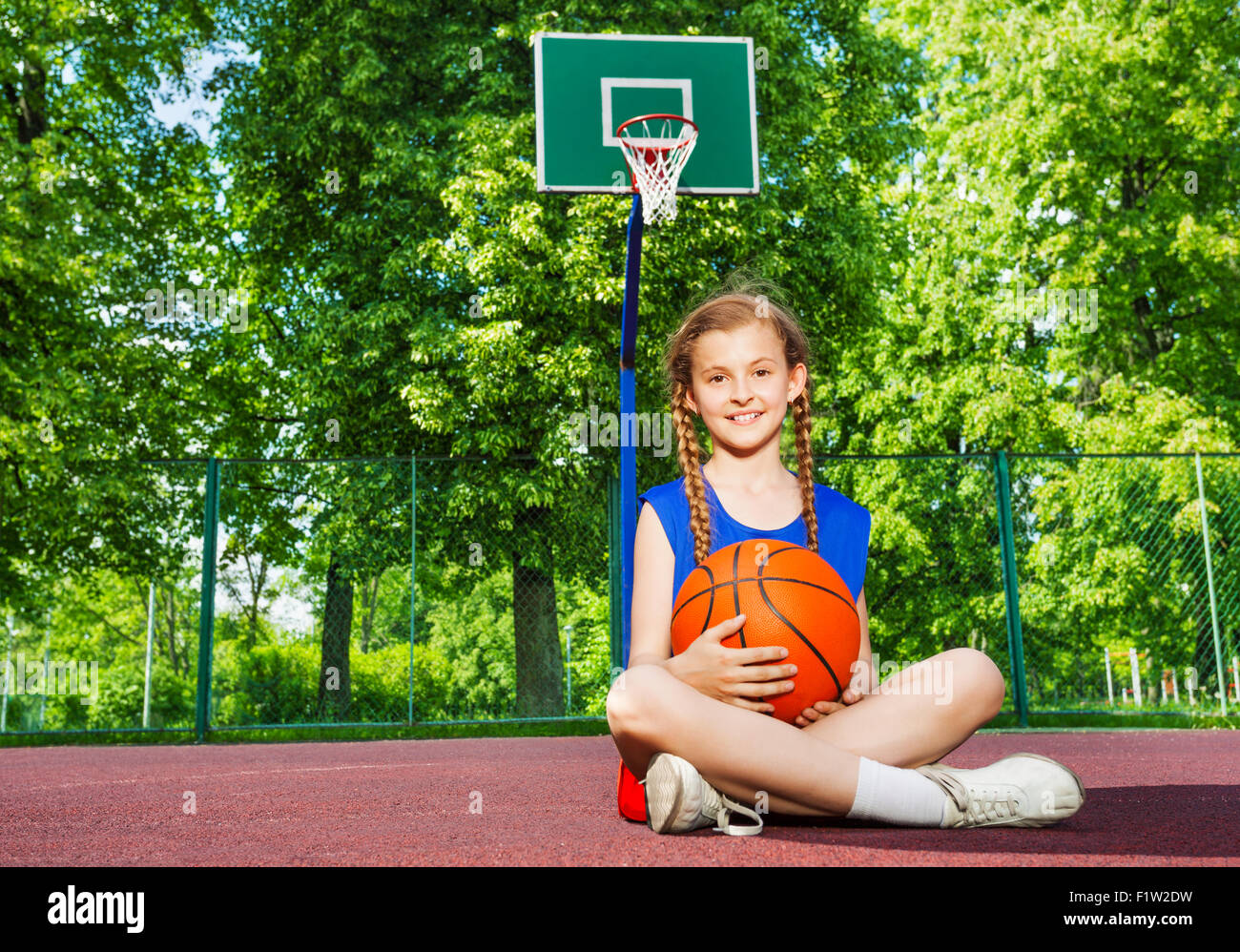 Teen girl sitting knees up hi-res stock photography and images - Alamy